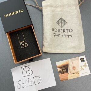 Custom made Roberto Designs monogram necklace . Received two by mistake.